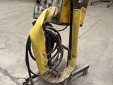a machine that is sitting on a cart in a warehouse