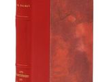 un livre rouge avec une couverture rouge et des lettres dorées