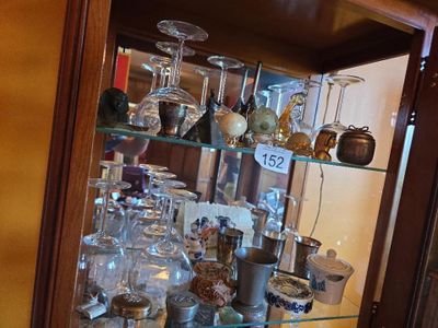 a glass case with many different items in it