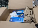 a cardboard box with a bunch of books inside of it