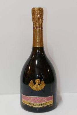 bottle of champagne on a white table with a white background