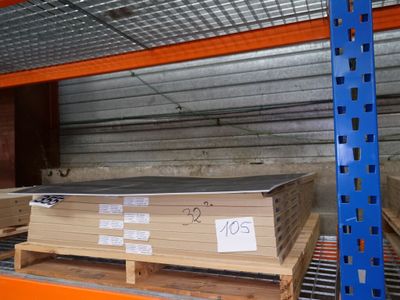 a large stack of wood on a pallet in a warehouse