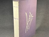 the book is purple and white with a hand drawn design on it