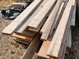 several pieces of wood are stacked on top of each other in a pile