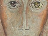 painting of a woman ' s face with yellow eyes and long hair