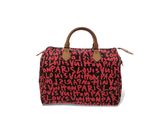 un sac de voyage rouge et noir posé sur une surface blanche