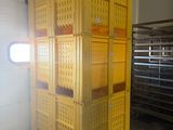 a large yellow crate in the middle of a room