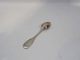 a silver spoon with a spoon handle on a white surface