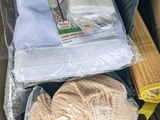 a cardboard box filled with clothes and a pair of scissors