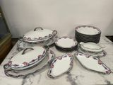 a lot of plates and bowls on the table