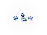 a group of three blue sapphires on a white background