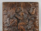 carved wood plaque depicting a man and a woman in a boat