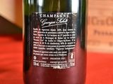 a bottle of wine that is sitting on a table