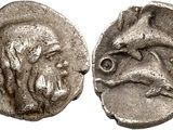 a silver coin with an image of a man on it