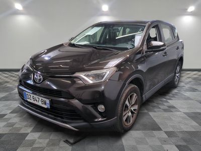 the toyota rav is parked on a checkered floor in a garage