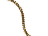 a close up of a gold bracelet on a white background