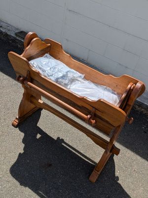 a baby crib that is sitting on a sidewalk