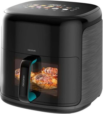 un gros plan sur une friteuse à air chaud contenant des pizzas
