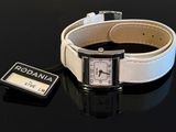 a white watch and a black watch on a black table