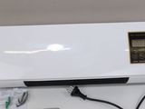 an image of a white air conditioner sitting on top of a table