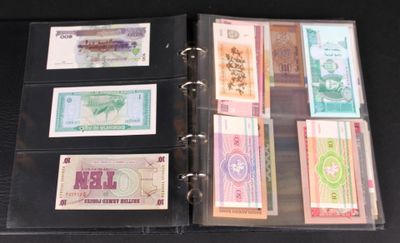a binder with a lot of different currency notes on it