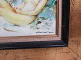 a painting of a woman sitting on a banana in a black frame