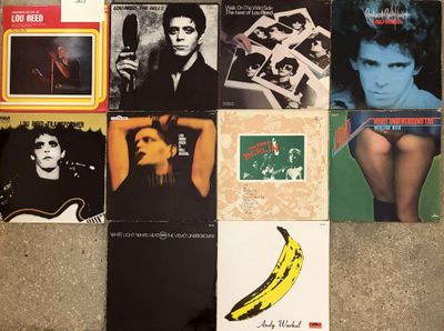 a lot of records on the floor with a banana on it
