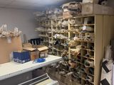 a room with a lot of boxes and a piano in it