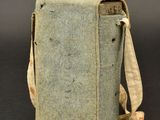 an old book bag with a strap on it