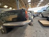 a black car that is parked in a garage