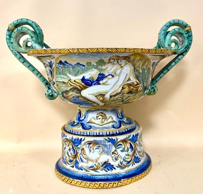 a large blue and white vase with a bird on it