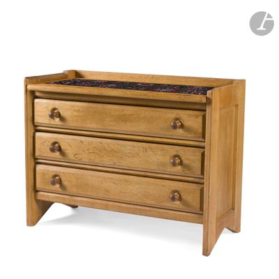 a close up of a wooden dresser with three drawers