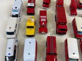 a lot of toy trucks that are sitting on a table