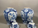 pair of blue and white vases on a gray background