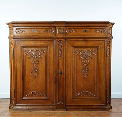an antique french walnut sideboard with carved carvings