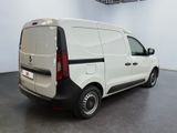a white van parked in a large room