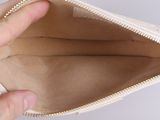 a person that is holding a small purse in their hand