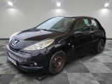 a picture of a small black car parked in a garage