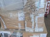a large stack of boxes sitting on a pallet in a warehouse