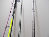 several fishing rods are lined up against a wall in a room