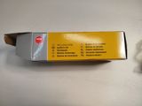 a box of cigarettes sitting on a table next to a lighter