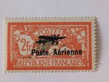 a close up of a stamp with an airplane on it