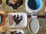 a table with a lot of dishes and cups on it