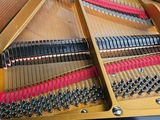 a close up of a piano that is being played by someone