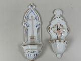 two wall sconces that are on the wall