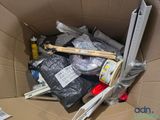 a cardboard box filled with assorted items in it