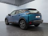 the rear end of a blue suv parked in a garage