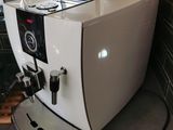 a coffee machine sitting on a counter in a kitchen