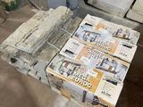 a stack of newspapers sitting on top of a wooden table