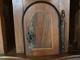 a wooden cabinet with a door and a door handle on it